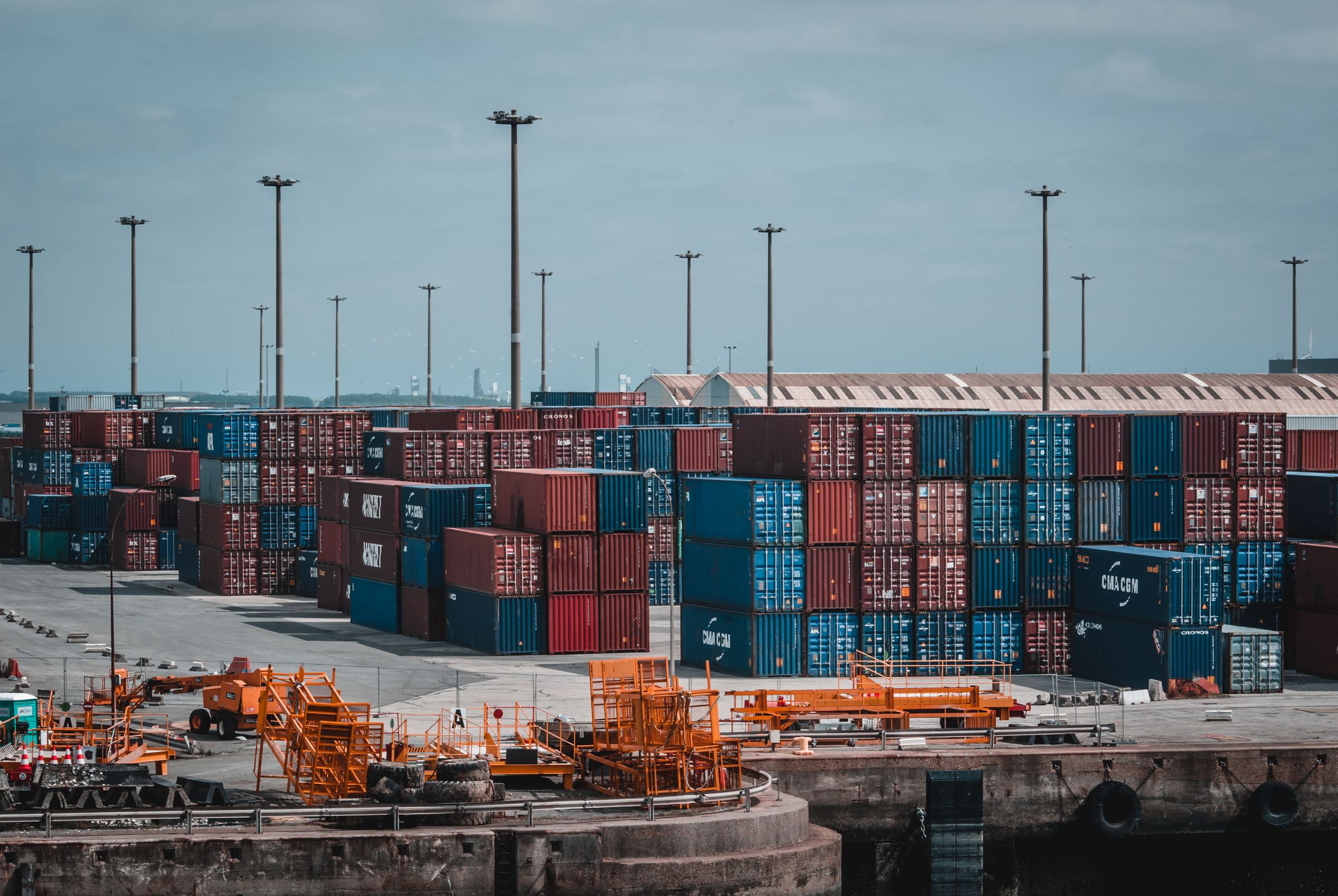 Stacked shipping containers in a terminal yard